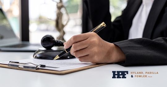 male-lawyer-signing-plea-agreement-client