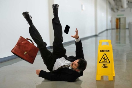 man slipping on floor